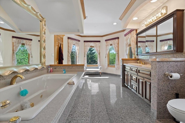 full bath featuring a tub with jets, a healthy amount of sunlight, granite finish floor, and crown molding