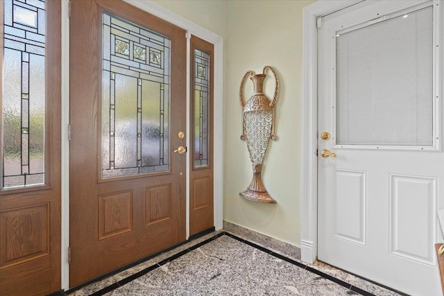 foyer entrance with baseboards