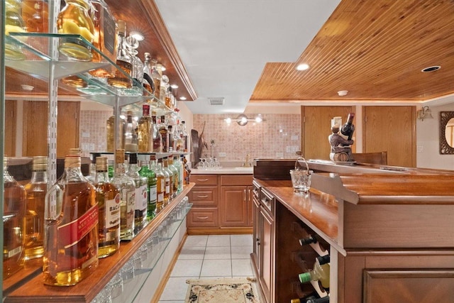 bar with light tile patterned floors, visible vents, wooden ceiling, indoor wet bar, and recessed lighting