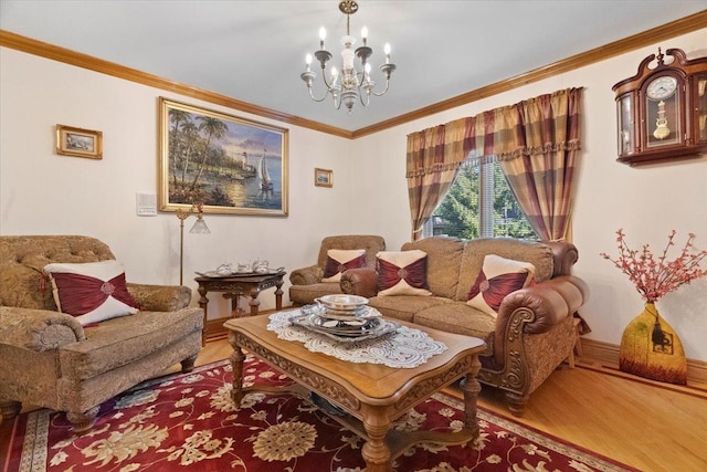 living room with an inviting chandelier, crown molding, baseboards, and wood finished floors