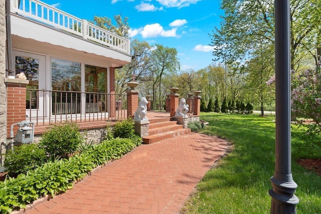 view of yard featuring a wooden deck