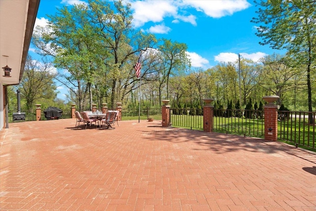 view of patio / terrace featuring grilling area, fence, and outdoor dining area