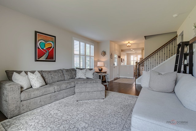 living room with dark hardwood / wood-style flooring