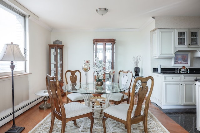 dining area featuring dark hardwood / wood-style flooring and a healthy amount of sunlight