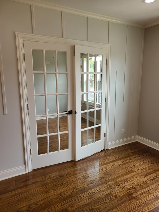 doorway with dark hardwood / wood-style flooring and french doors