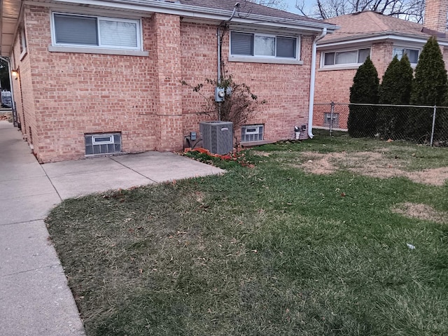 exterior space with central air condition unit and a patio area