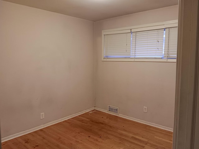 unfurnished room featuring light hardwood / wood-style floors