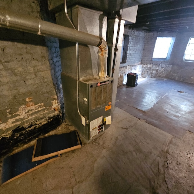 utility room with heating unit