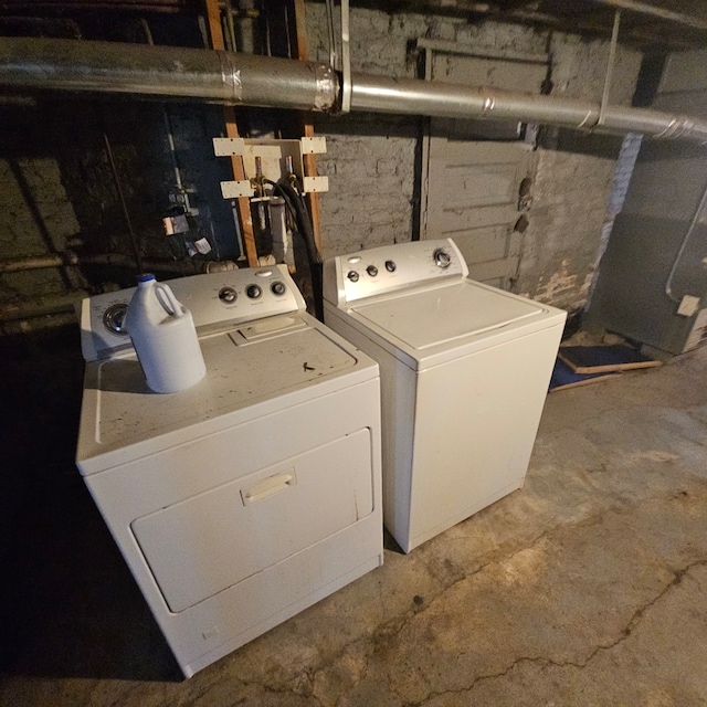 clothes washing area with washer and dryer