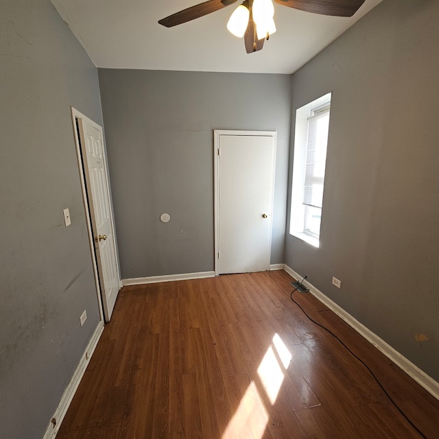 unfurnished room featuring wood-type flooring and ceiling fan