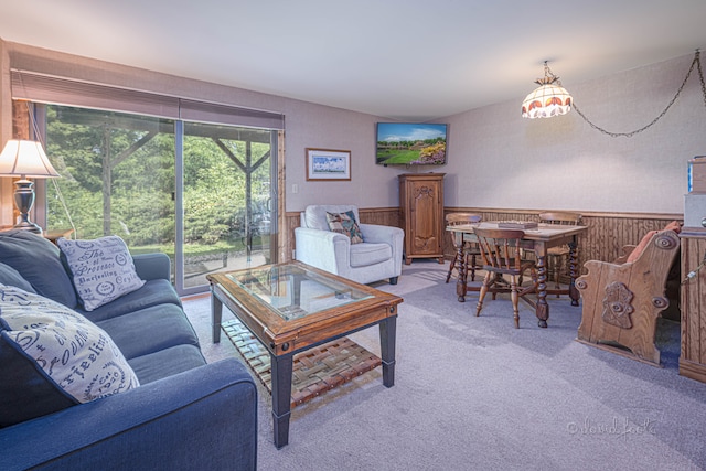 living room featuring carpet flooring and a healthy amount of sunlight