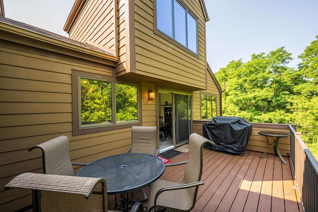 wooden deck featuring area for grilling