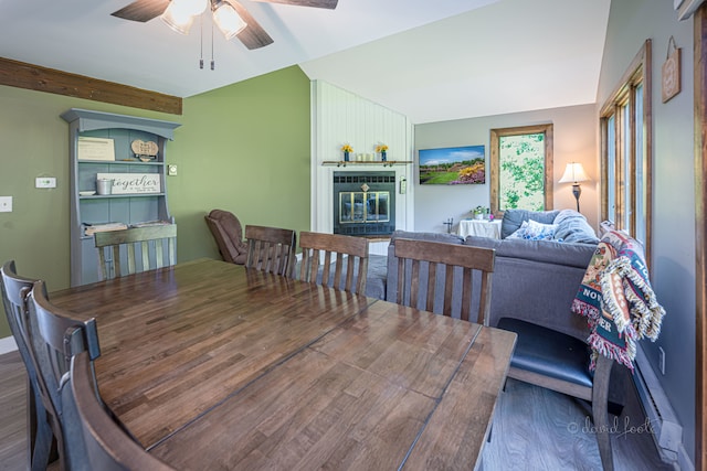 dining area with hardwood / wood-style floors, a baseboard radiator, and ceiling fan