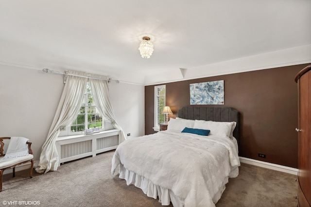 carpeted bedroom featuring radiator