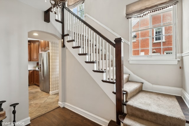 staircase featuring wood-type flooring