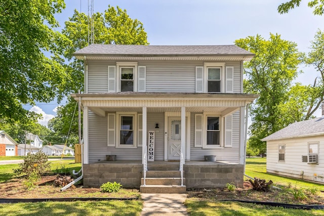 view of front of house featuring cooling unit and covered porch