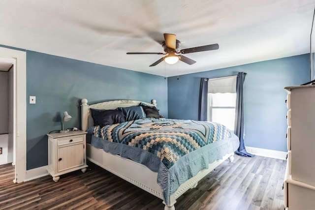 bedroom featuring dark hardwood / wood-style floors and ceiling fan