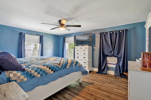 bedroom featuring ceiling fan and dark hardwood / wood-style flooring