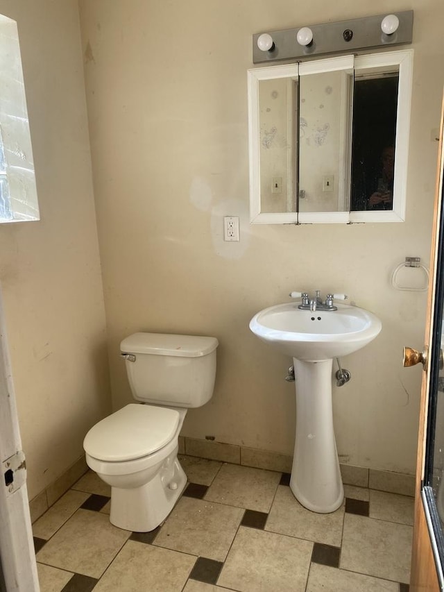 bathroom featuring toilet