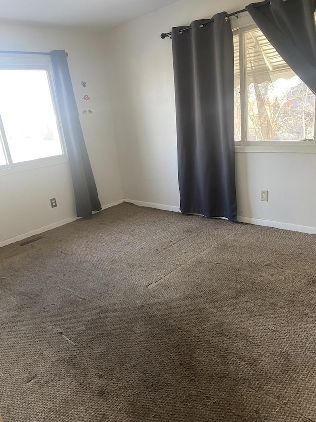 unfurnished room featuring carpet flooring