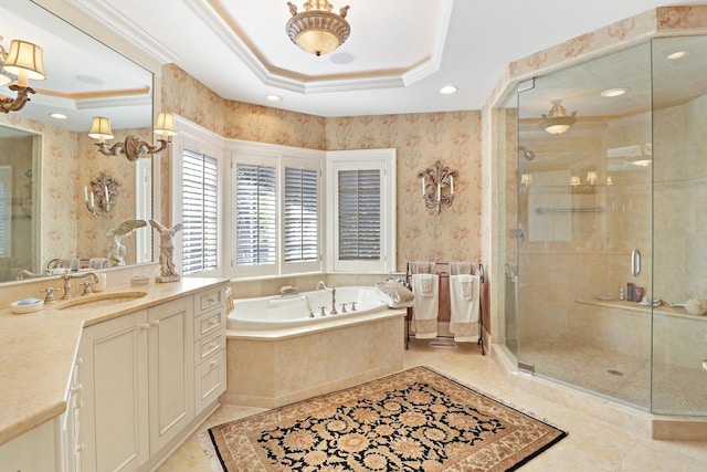 bathroom featuring ornamental molding, a raised ceiling, and separate shower and tub