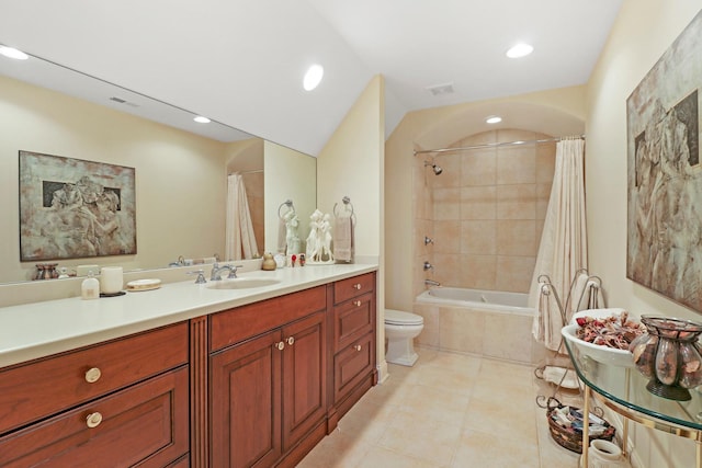 full bathroom featuring tile patterned floors, vanity, toilet, and shower / bath combo