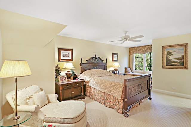 bedroom featuring light carpet and ceiling fan