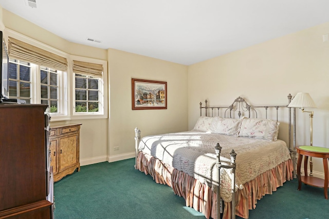 bedroom with dark carpet