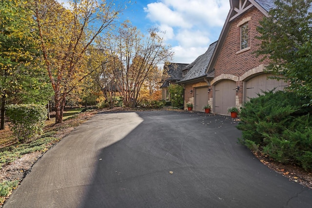 view of side of property featuring a garage