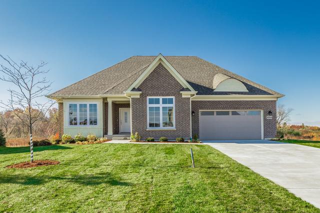 view of front of home with a garage and a front yard