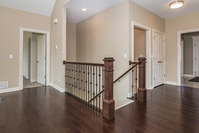 hallway featuring dark hardwood / wood-style floors