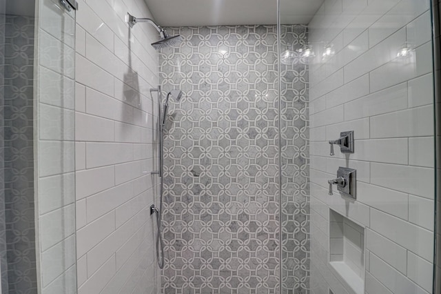 bathroom with tiled shower