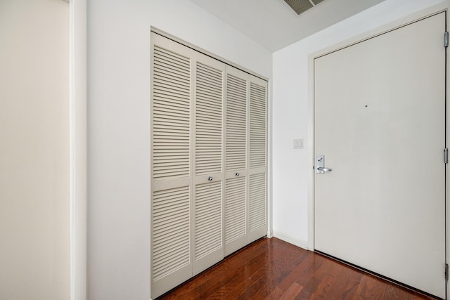 interior space with dark hardwood / wood-style flooring