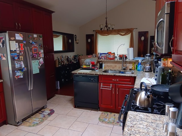 kitchen featuring stainless steel fridge, vaulted ceiling, sink, a notable chandelier, and black dishwasher