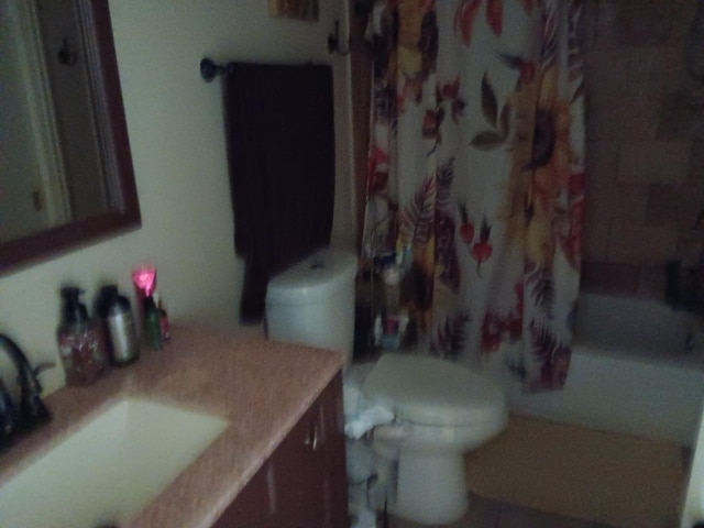 full bathroom with tile patterned flooring, vanity, shower / bath combo, and toilet