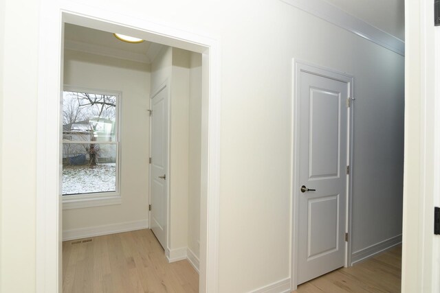 kitchen with pendant lighting, stainless steel fridge, ornamental molding, and tasteful backsplash