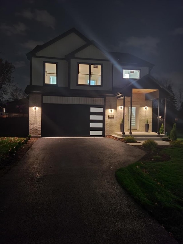 view of front of property with a garage