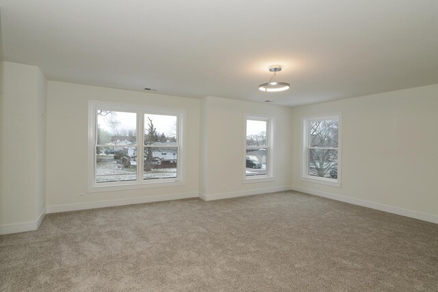 unfurnished room with light colored carpet