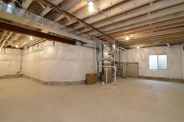 full bathroom with tile patterned floors, vanity, tiled shower / bath combo, and toilet