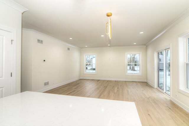 kitchen with tasteful backsplash, hanging light fixtures, stainless steel dishwasher, and ornamental molding