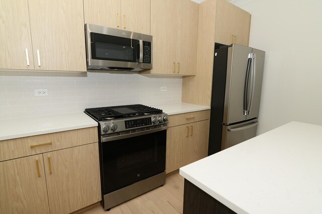 interior space featuring a wealth of natural light, light hardwood / wood-style flooring, and ornamental molding