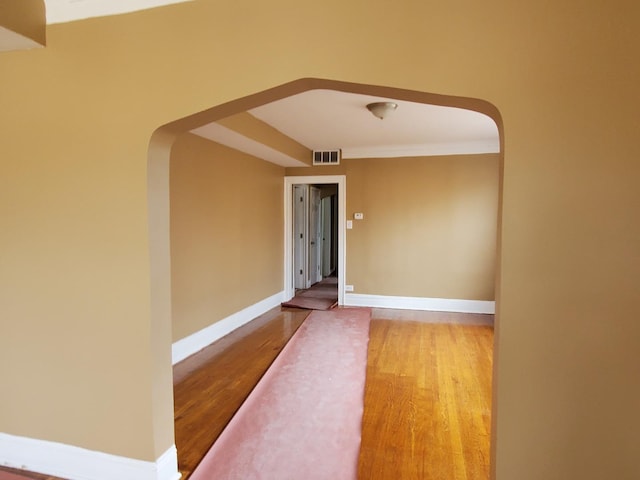 spare room featuring hardwood / wood-style flooring