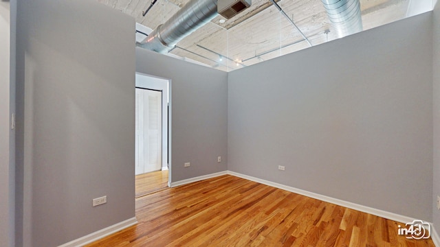 unfurnished room featuring wood-type flooring