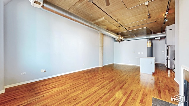 unfurnished room with hardwood / wood-style floors