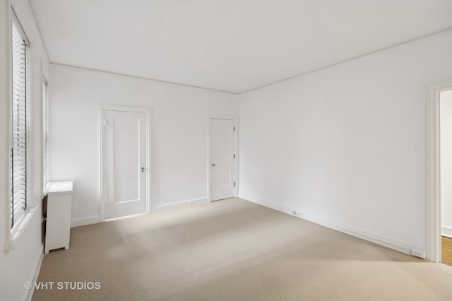 unfurnished bedroom with light colored carpet