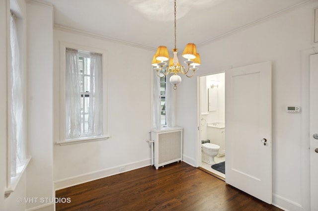 unfurnished dining area with radiator, ornamental molding, dark hardwood / wood-style floors, and a notable chandelier