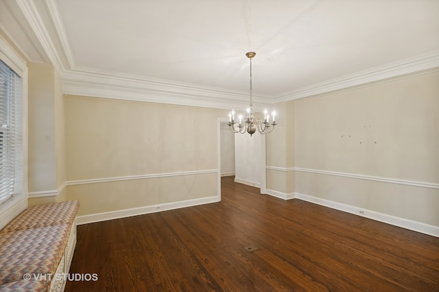 unfurnished dining area with dark hardwood / wood-style flooring, crown molding, and an inviting chandelier