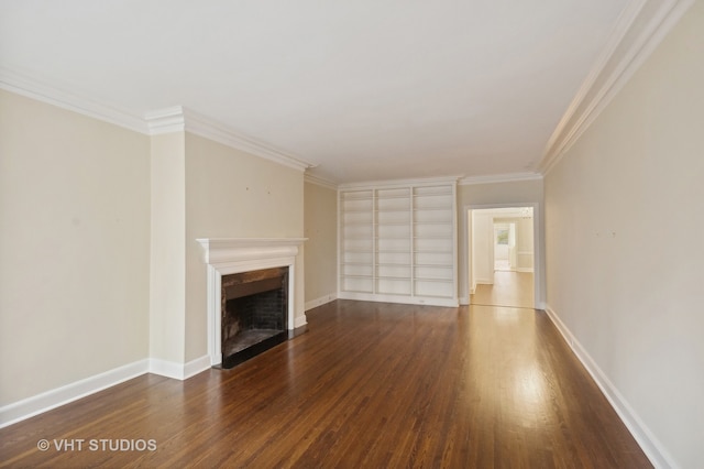 unfurnished living room featuring built in shelves, crown molding, and dark hardwood / wood-style floors