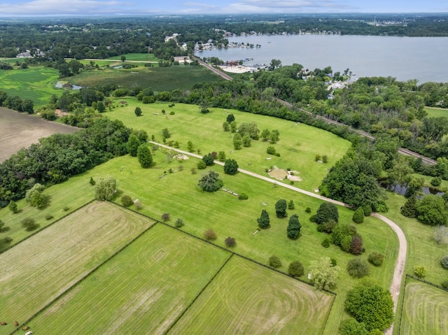 drone / aerial view featuring a water view and a rural view