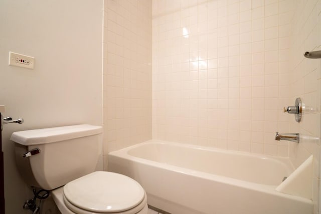 bathroom with shower / bathing tub combination and toilet